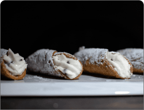 Cannoli dusted with powdered sugar